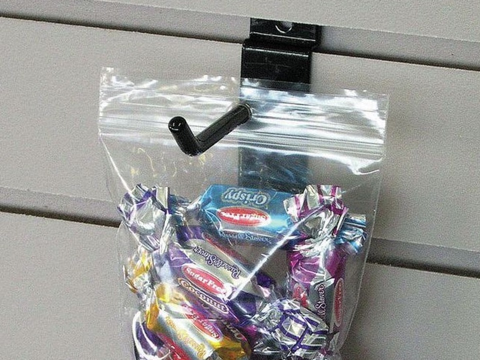Clear zip lock bag with a hang hole, hanging on a retail display hook